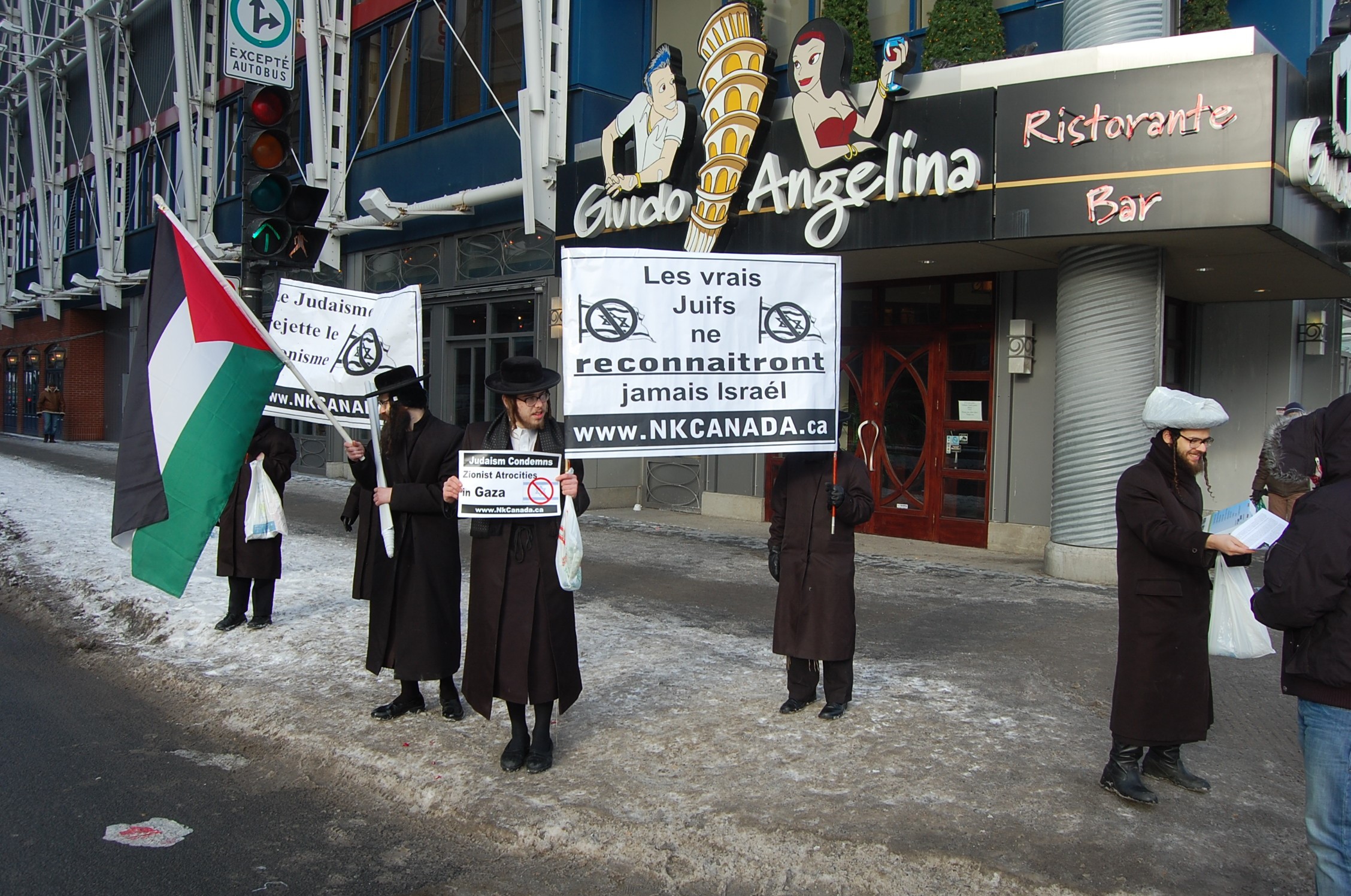 NK members hand out anti-Israel fliers in Montreal, 2009 (Wikmedia Commons)